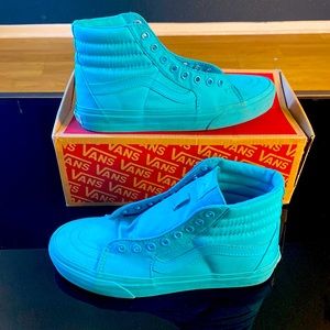 Turquoise Vans high tops